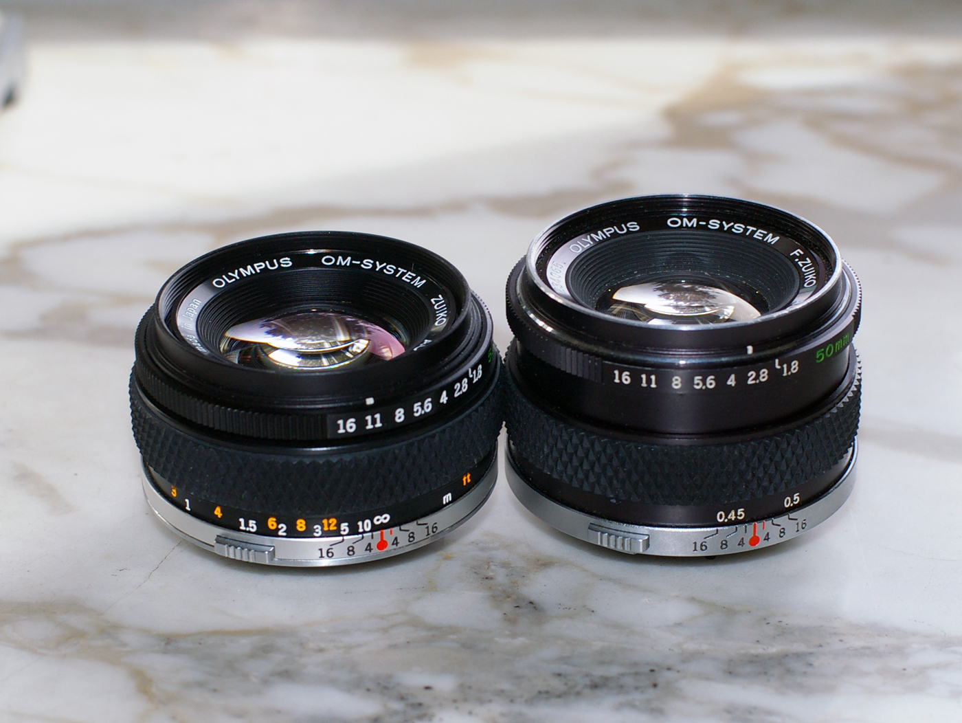 Earliest and latest versions of Zuiko 1.8/50mm